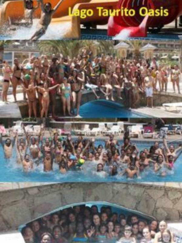Familias y amigos disfrutan de un día de diversión en el Lago Taurito Oasis, con actividades acuáticas y risas compartidas.