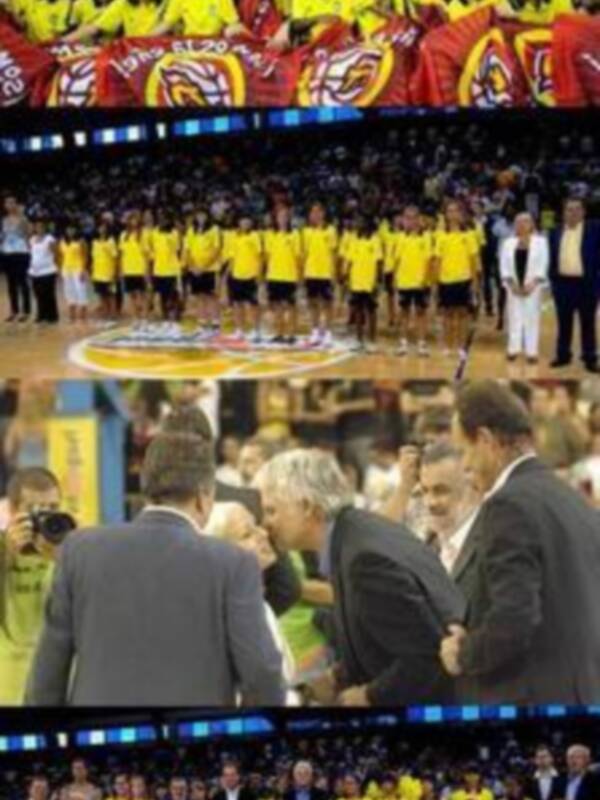 Una escena de un partido de baloncesto con una multitud de espectadores y jugadores en el centro.