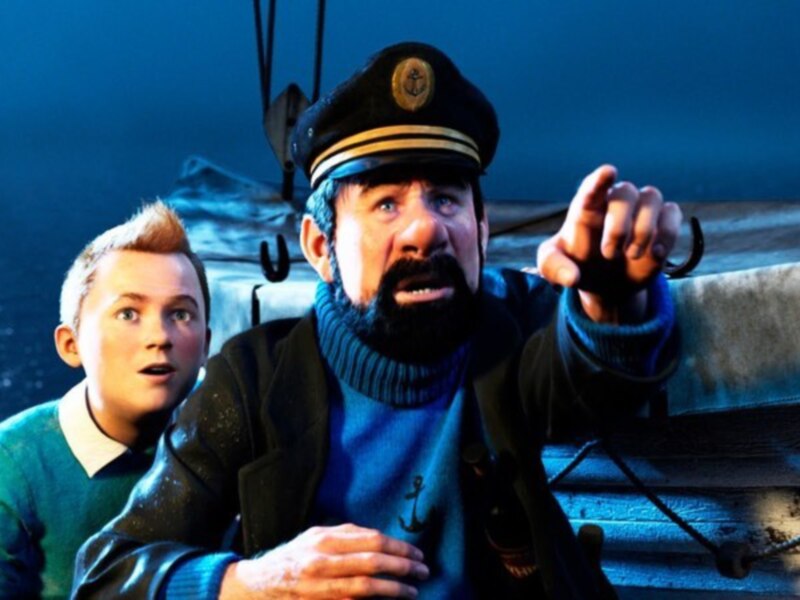 Dos personajes en un barco, uno vestido como capitán y el otro con una expresión asombrada, apuntando hacia el horizonte.
