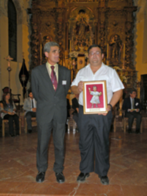 Provincia.El Profesor e Historiador D. Manuel Morales Morales, pronuncio una disertación, sobre el canto de la Sentencia de Pilatos en la Hermandad de Jesús Nazareno de Alcalá del Río.