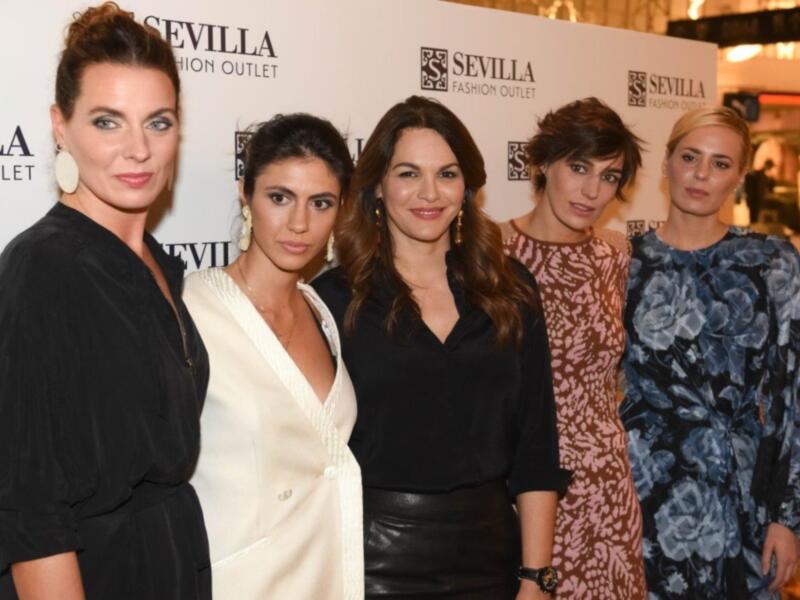 Four women posing together at a Sevilla Fashion Outlet event.