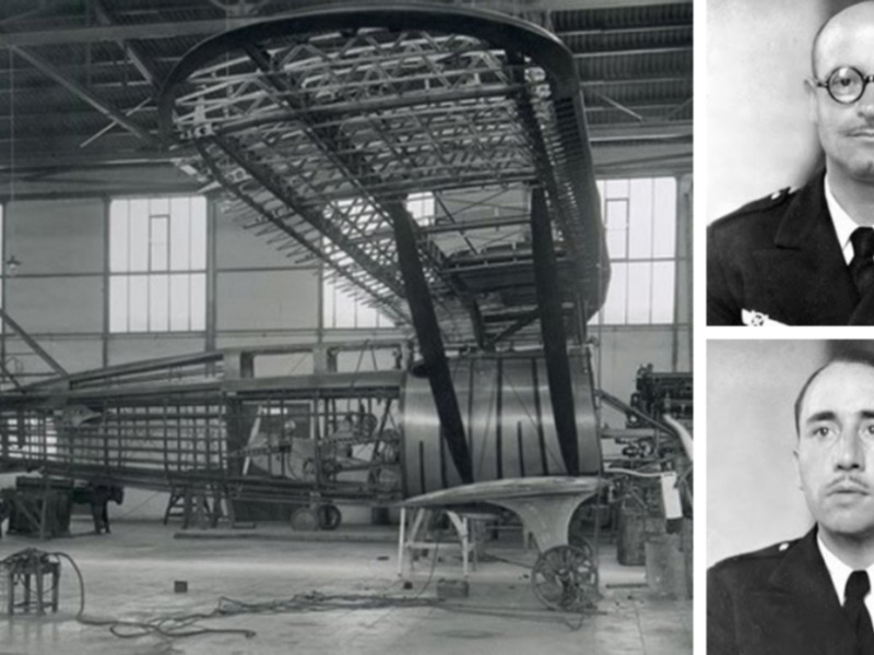 Interior de un hangar con estructura de avión en construcción y retrato de un oficial militar.