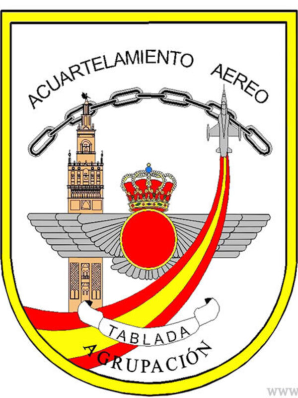 Escudo del Acuartelamiento Aéreo de Tablada, con símbolos militares y bandera española.