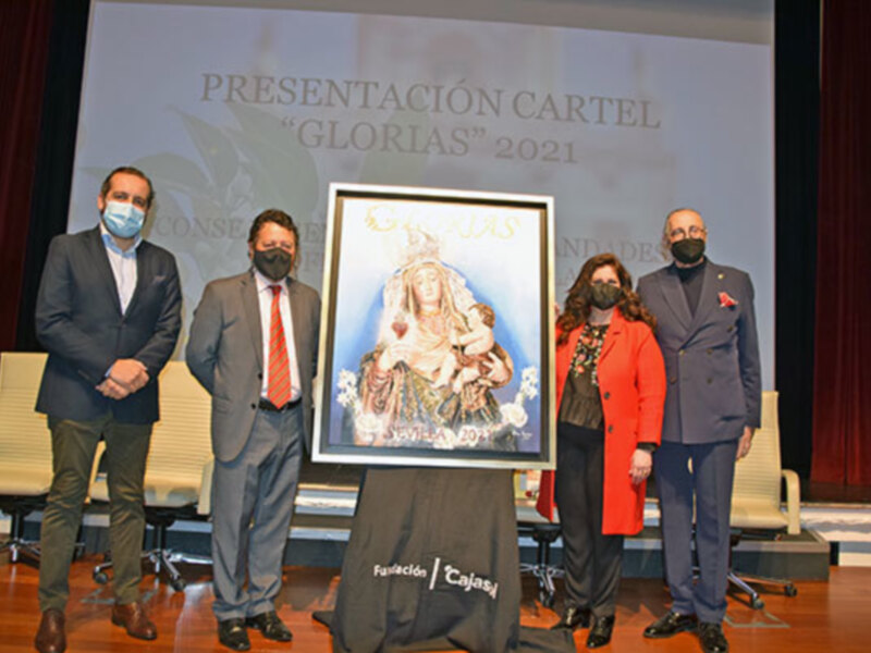 Presentación del cartel de las Glorias de Sevilla 2021 en un evento oficial con autoridades y el cartel en el centro.