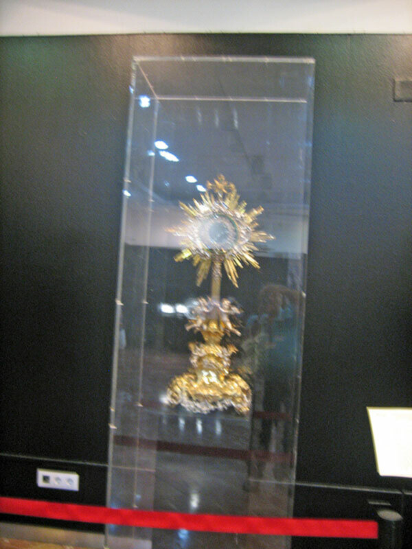 Monstrance containing a relic in a museum display case.