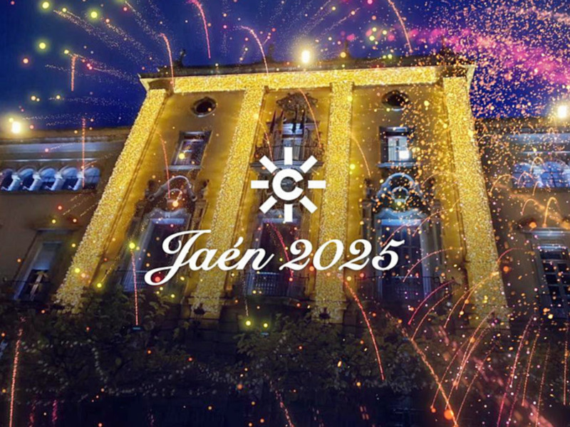 Fiesta de fuegos artificiales en la ciudad de Jaén, España, con un edificio iluminado y celebrando el año 2025.