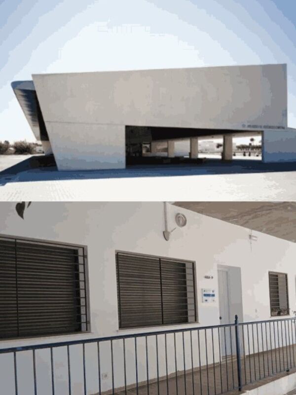 Estructura moderna con detalles arquitectónicos y detalles de seguridad en la parte inferior de la imagen.